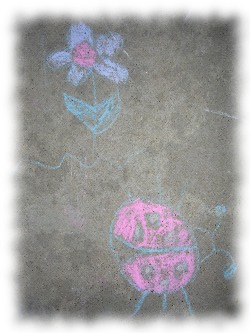 Sidewalk chalk flower and ladybug by my oldest daughter.