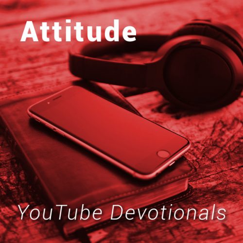 Bible, smart phone, headphones on table with text Attitude YouTube Devotionals