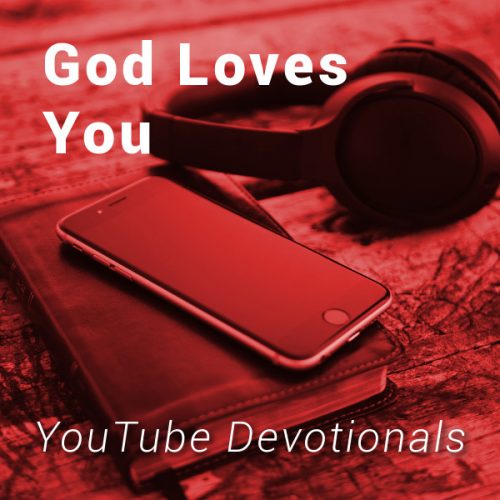 Bible, smart phone, headphones on table with text God Loves You YouTube Devotionals