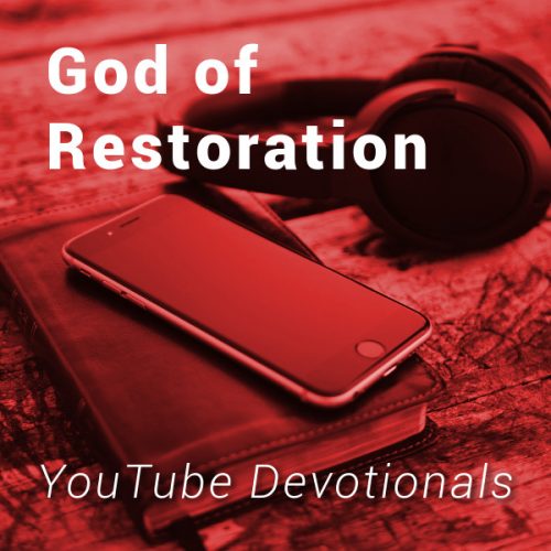 Bible, smart phone, headphones on table with text God of Restoration YouTube Devotionals