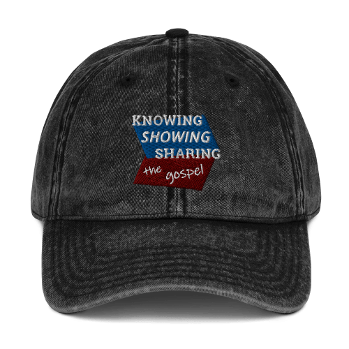 Black denim-style baseball cap with Knowing Showing Sharing the gospel on blue and red background