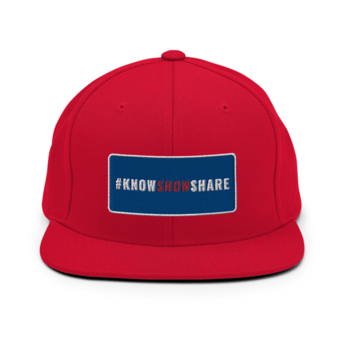 Red snapback hat with hashtag Know Show Share inside a blue rectangle with white border