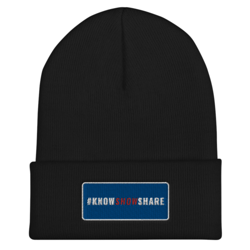 Black cuffed beanie with hashtag Know Show Share inside a blue rectangle with white border