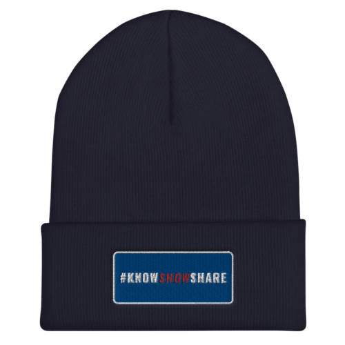 Navy blue cuffed beanie with hashtag Know Show Share inside a blue rectangle with white border